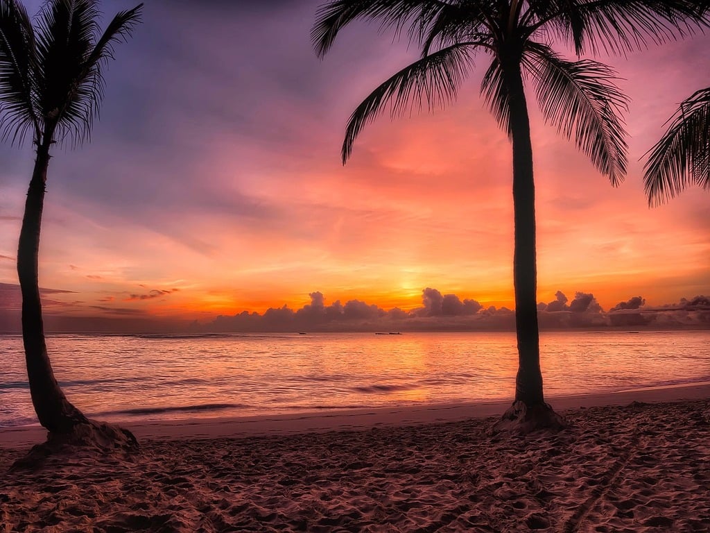 Photo via https://cdn12.picryl.com/photo/2016/12/31/dominican-republic-sunrise-dawn-travel-vacation-fbb11c-1024.jpg under the Creative Commons License
