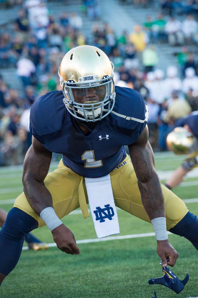 Photo via https://cdn2.picryl.com/photo/2014/09/06/university-of-notre-dame-running-back-greg-bryant-stretches-059999-1024.jpg under the Creative Commons License

